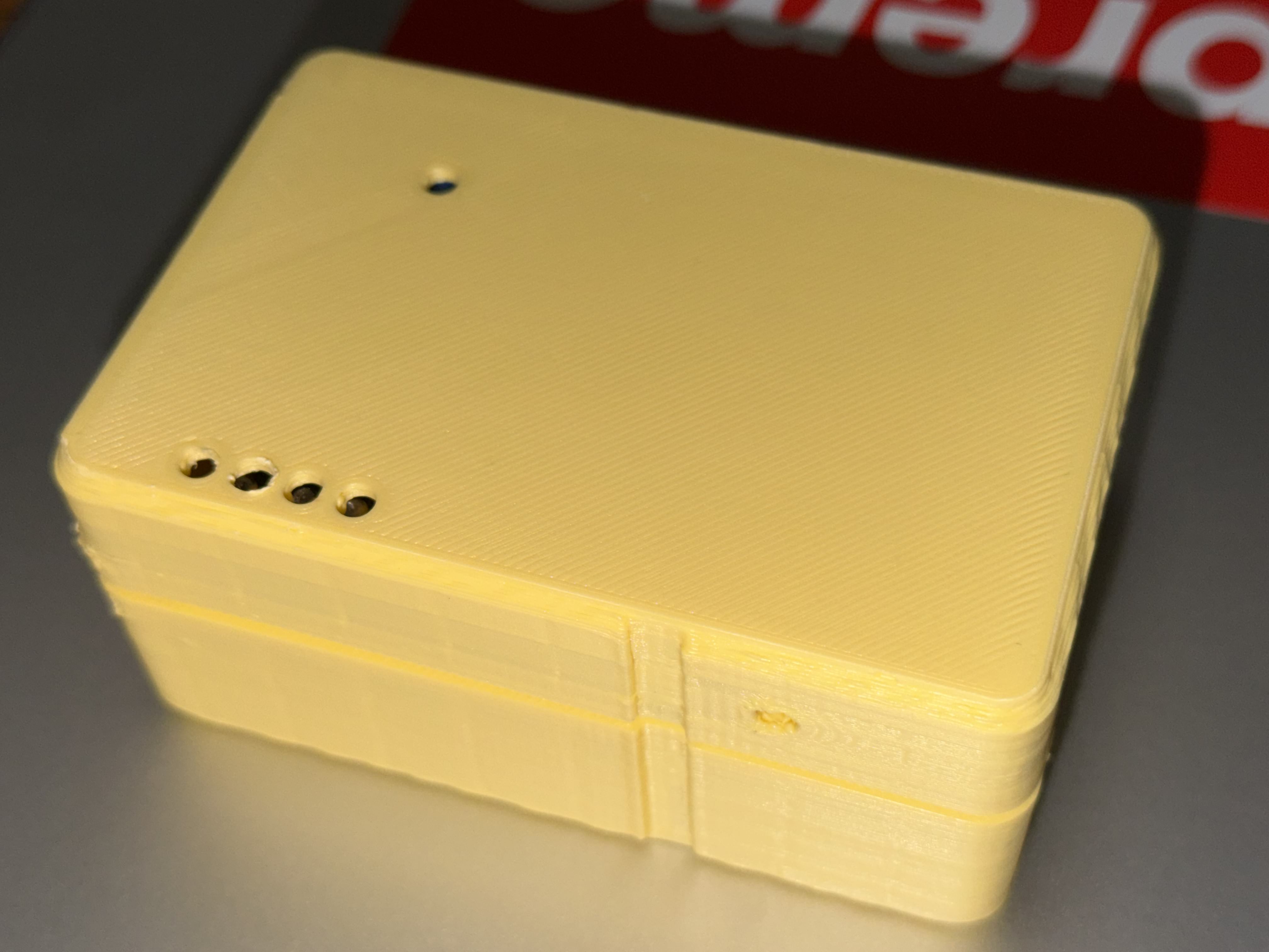 Full yellow PLA case assembled, soft rounded edges, screw mounts, LED openings